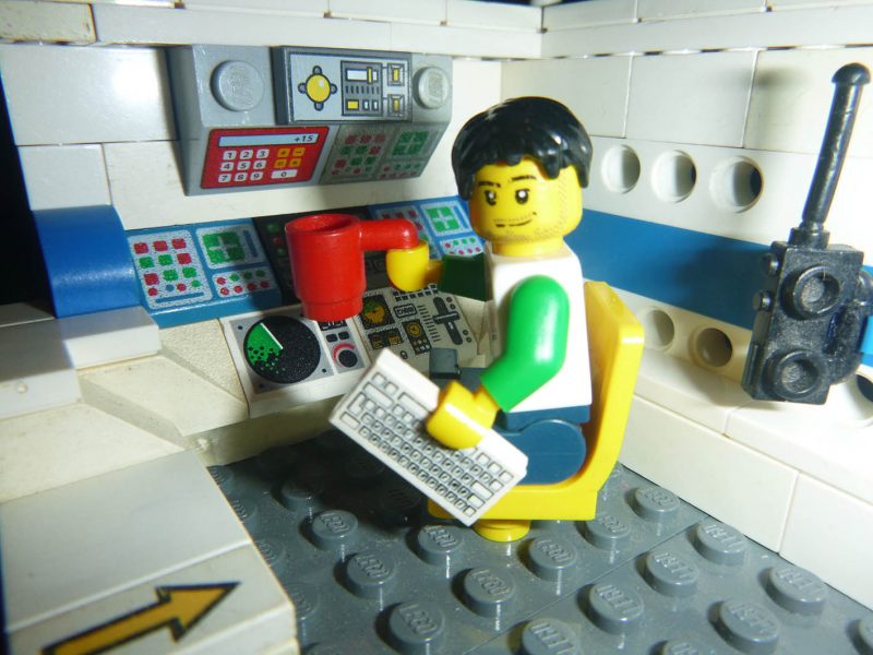 Image of a lego man at his lego work desk