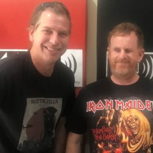 Jeremy harris stands next to Ryan Honschooten at his radio station 