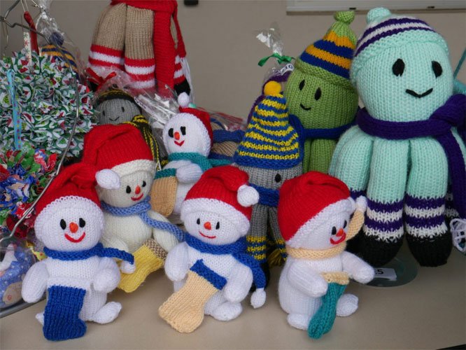 Image of handmade, knitted snowmen and octopus, made by the CAC clients like Dorothy